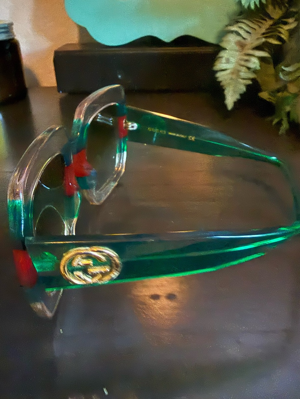 Gucci Transparent Green Frame Sunglasses with Red Accents and Gold Logo Emblem